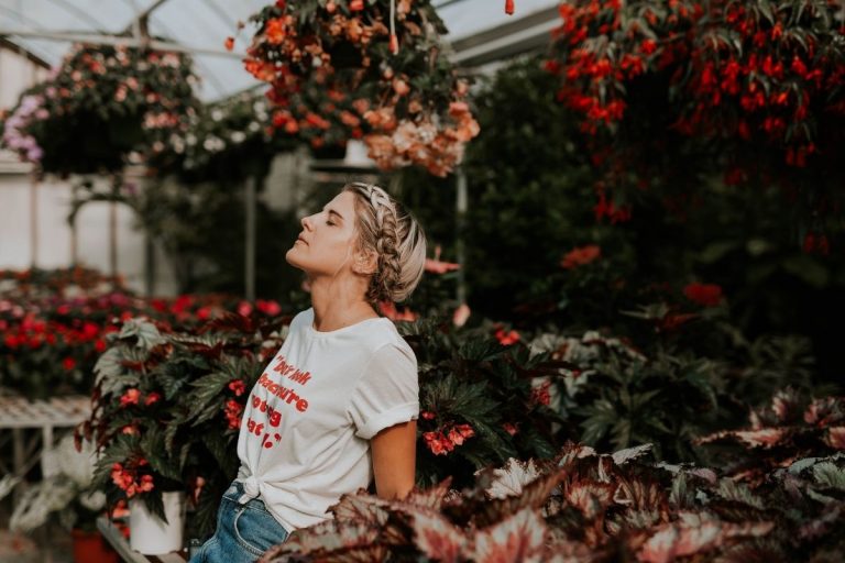 How to Have a Closer Relationship With God woman praying in a flower garden