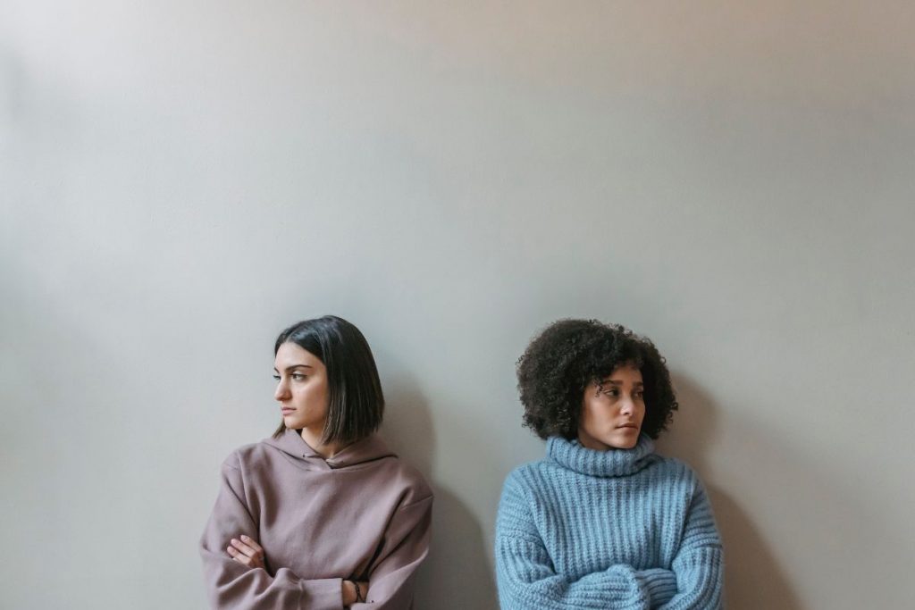 two women, indifferent to one another