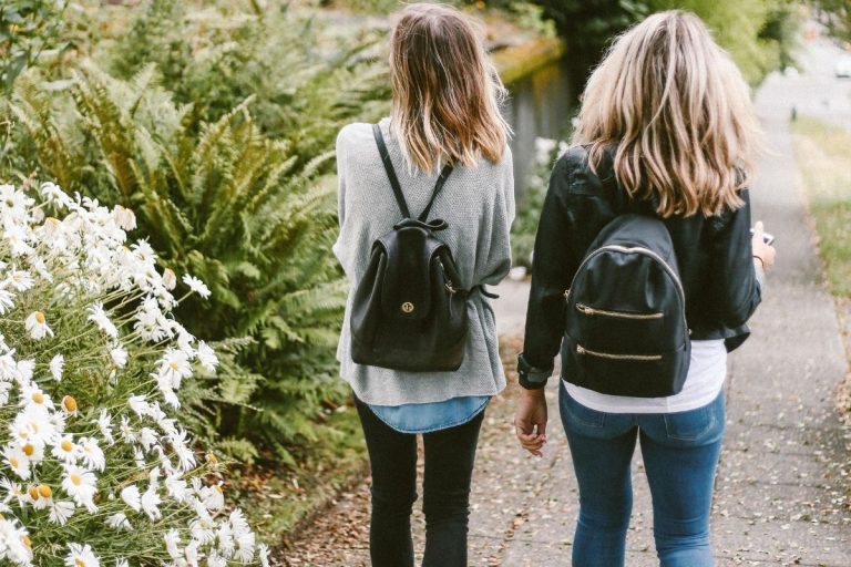 two women walking side by side