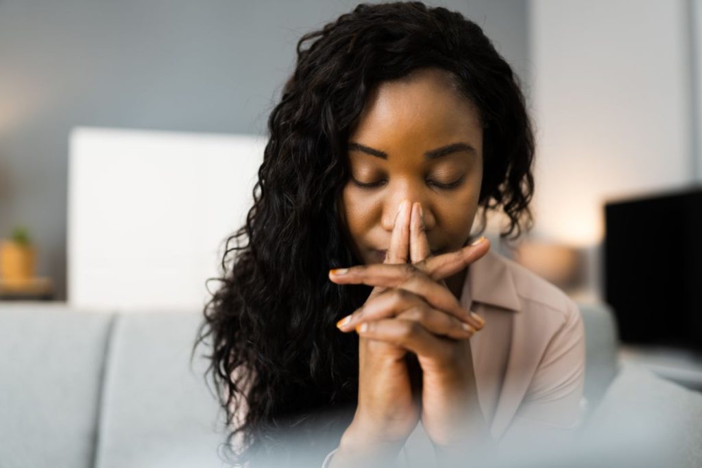 black woman in prayer