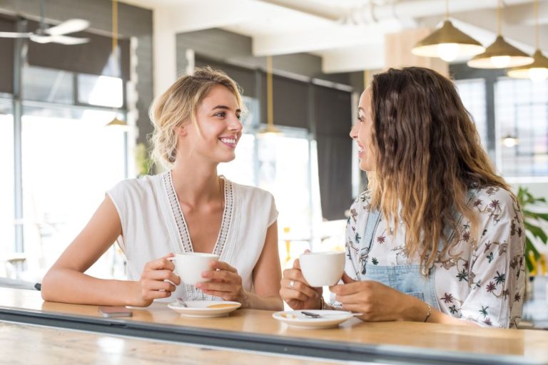 two women Speaking in a Language Others Understand