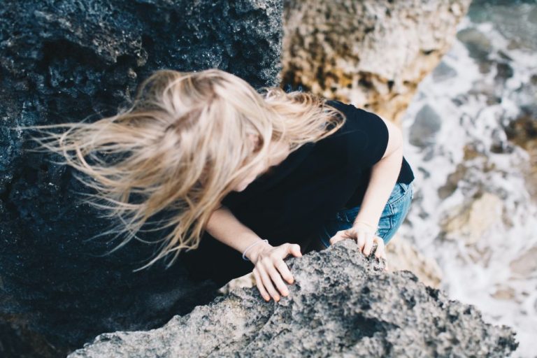 a woman between two rocks