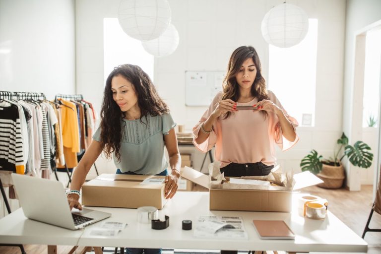 online clothing boutique owners boxing up orders