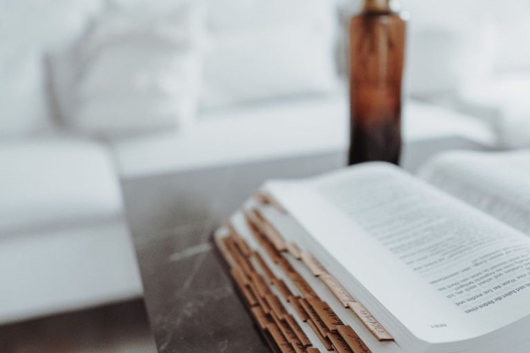 the bible open and sitting on a table