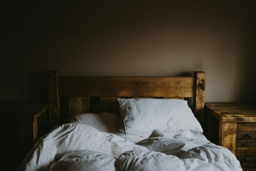 a rumpled, empty, slept in bed