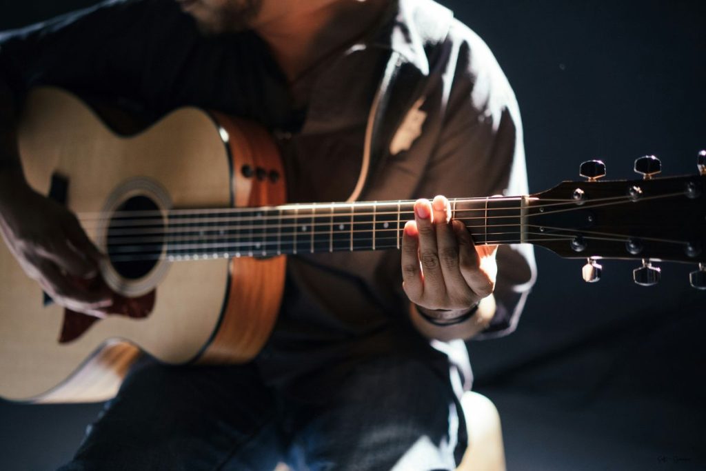 a musician playing a guitar