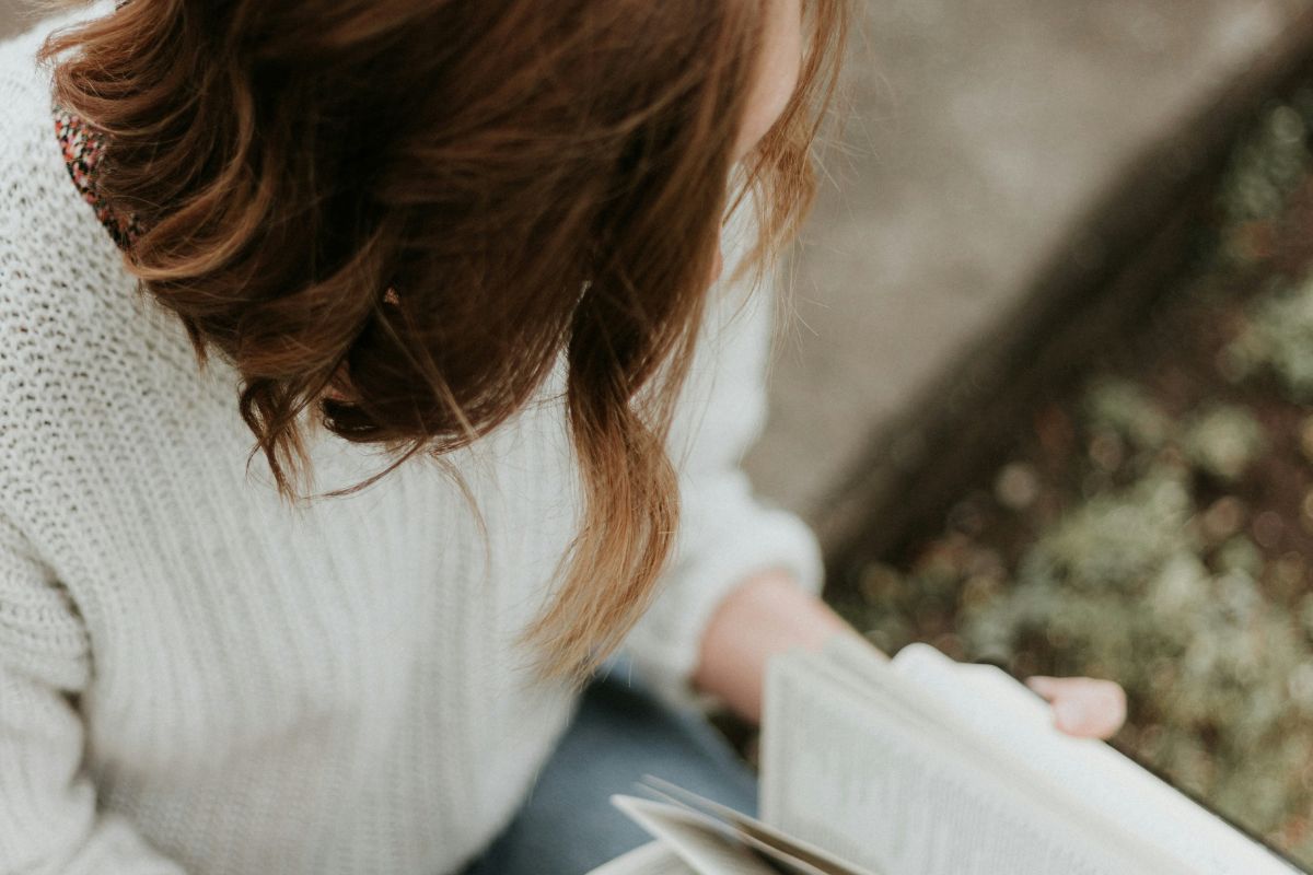 a woman flipping through her bible