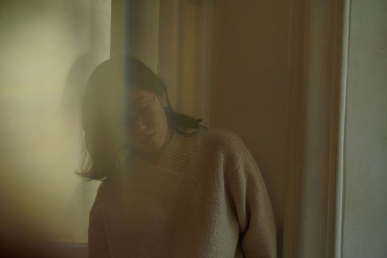 a blurry image of a woman that gives the impression she's coming undone