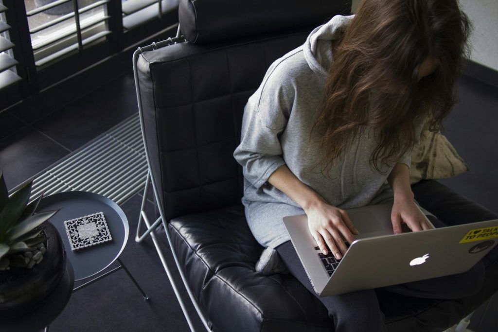 a woman sitting at her laptop working